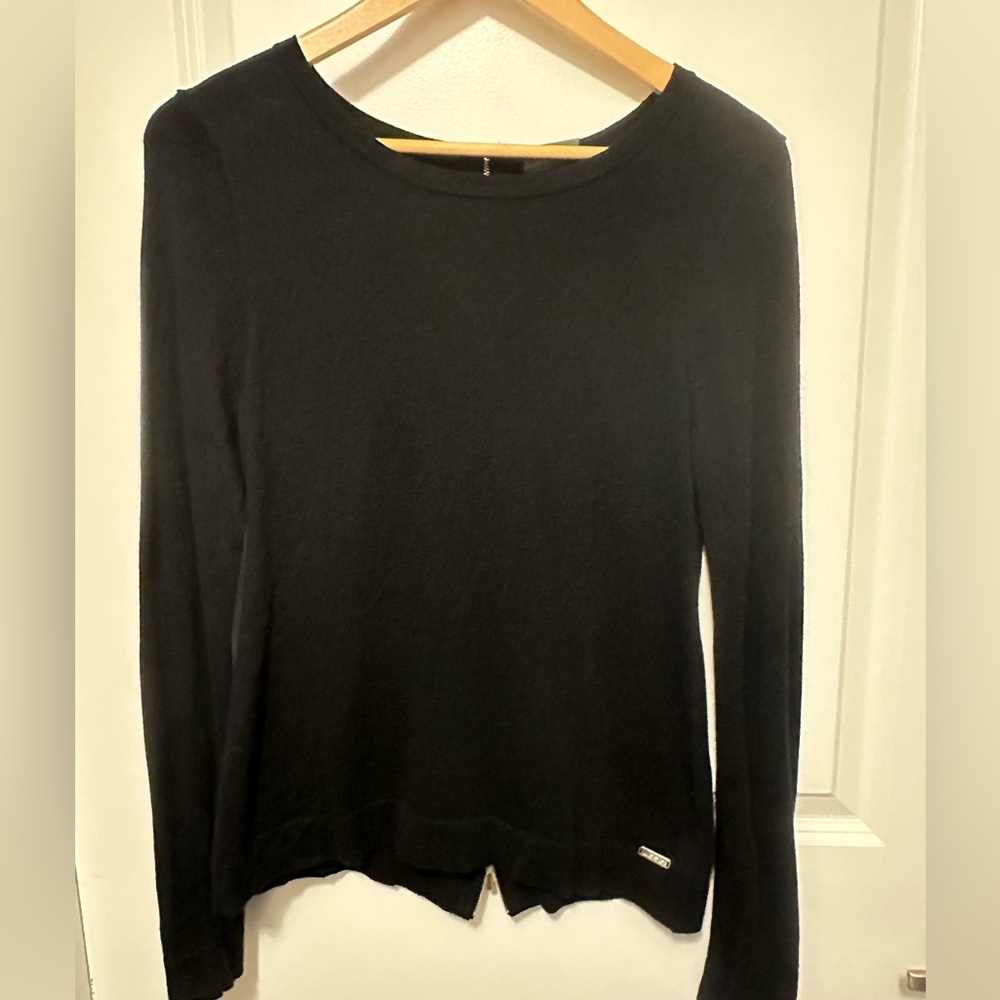JoFit golf size small black sweater. Back zip detail. Only worn a couple times.